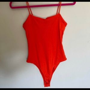 Orange body suit